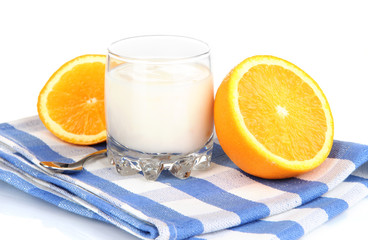 Delicious yogurt in glass with orange isolated on white