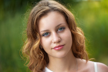 Naklejka premium Outdoor portrait of young pretty women with ginger hair