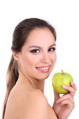 Smiling woman with apple isolated on white