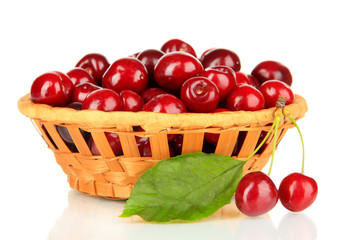 Cherry berries in wicker basket isolated on white
