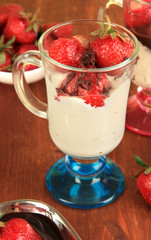 Delicious strawberry desserts in glass vase