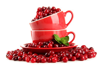 Ripe red cranberries in cups, isolated on white.