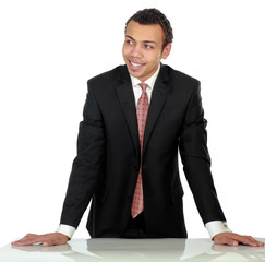 A young man standing near desk, isolated on white background