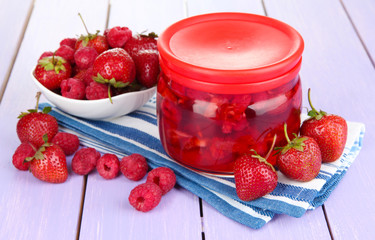Home made berry jam on wooden table