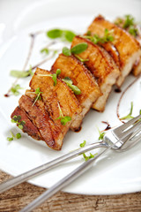 grilled pork on white plate, restaurant portion
