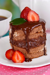 Chocolate cake with strawberry on table close-up