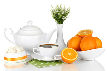 Beautiful white dinner service with oranges isolated on white