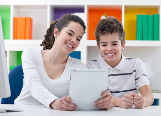 Smiling children with digital tablet