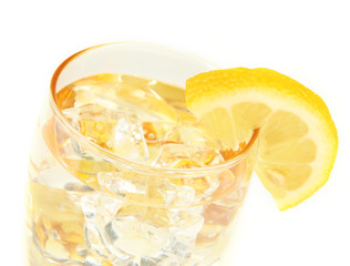 Glass with water and ice isolated on white