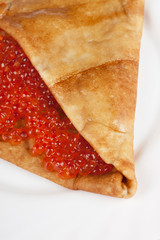 Pancake with red caviar