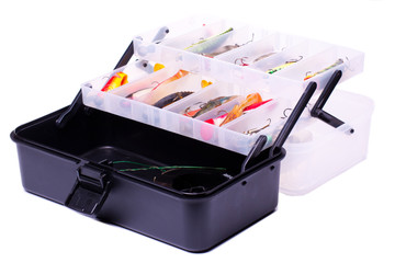 Opened fishing box with lures on a white background