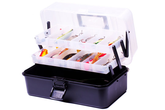 Opened fishing box with lures on a white background