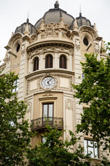Fototapeta na wymiar Clock on Old Domed Building in Barcelona