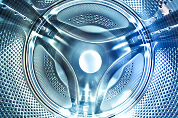 inside view into blue washing machine drum moving