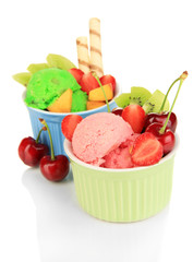 Delicious  ice cream with fruits and berries in bowl isolated