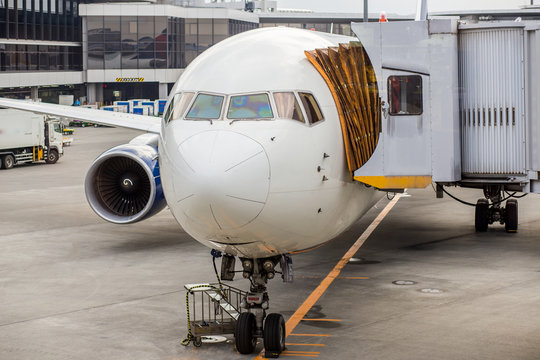 An airplane stationary at the airport