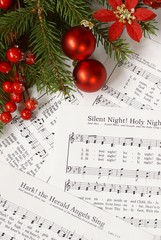 Sheets of Christmas carols. Focus on decorations