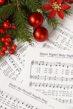 Sheets of Christmas carols. Focus on decorations