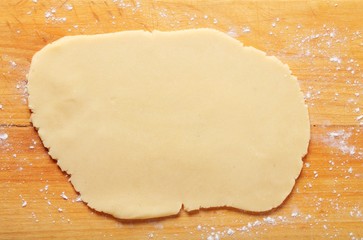 Dough on wooden board