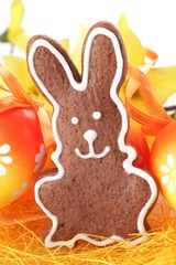 Close-up of gingerbread bunny and Easter eggs.