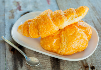Breakfast with fresh baked croissants and coffee.