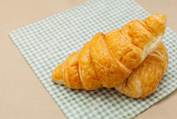 Breakfast with fresh baked croissants and coffee.