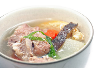 Pork ribs and vegetable soup in a  bowl