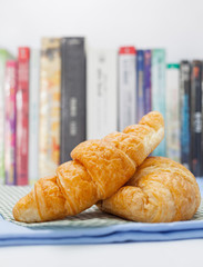 Breakfast with fresh baked croissants and coffee.