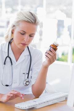 Nurse holding a medicine jar