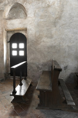 Old door and bench in an old church