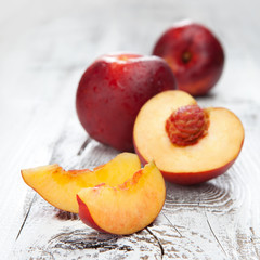 Fototapeta na wymiar Fresh and tasty peaches on a table