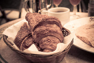 Breakfast with coffee and croissants