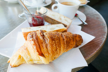 Breakfast with coffee and croissants