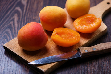 Apricots on wan old wooden plank © Kamila Cyganek