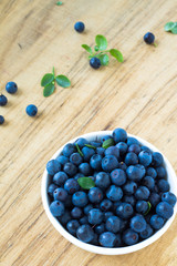 Bunch of fresh blueberry the white bowl