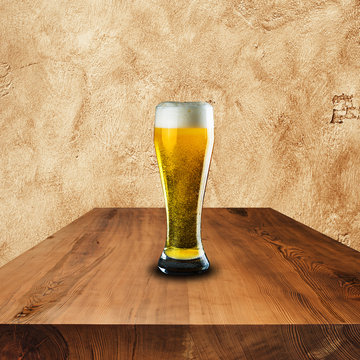 Glass of beer on wood table