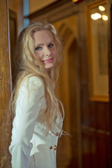 Beautiful blonde woman in luxurious interior