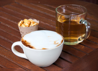 hot coffee on table and tea snack