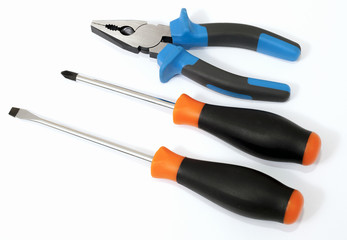 nippers and screwdrivers on white background