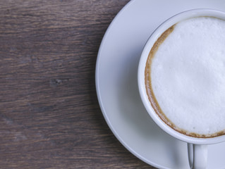 cappuccino coffee on wooden table