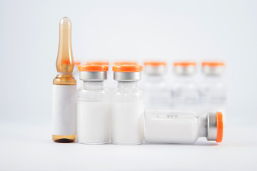 Brown injection ampule and white suspension vial