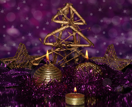 Christmas Composition  With Candles And Decorations In Purple