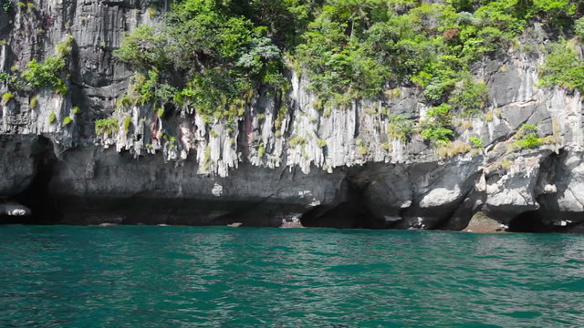 Calcareous rocks in the tropical bay. Thailand.