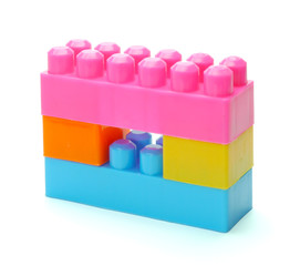 Plastic interlocking toy blocks isolated on white background