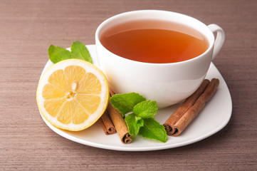 Cup of tea with lemon and mint