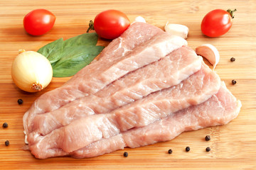 Raw pork with spices and vegetables