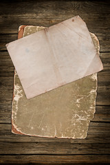 Vintage papers on a dark wooden background