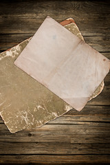 Faded vintage papers on wood