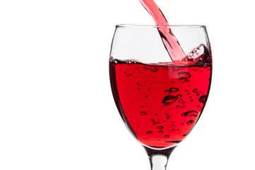 Pouring red wine into a glass