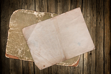 Old ragged papers on wood